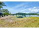 Waterfront property features a covered boat lift for easy access to boating and water activities at 2100 Oyster Creek Dr, Englewood, FL 34224