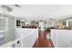A spacious entertainment area on the upper level with a bar and flexible spaces for recreation at 2100 Oyster Creek Dr, Englewood, FL 34224