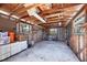 Unfinished garage with exposed studs, offering potential for customization and ample storage space at 2100 Oyster Creek Dr, Englewood, FL 34224