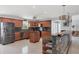 Bright kitchen with stainless steel appliances, granite counters, and a cozy island for meal prep and dining at 2100 Oyster Creek Dr, Englewood, FL 34224