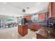 Well-lit kitchen featuring an island and stainless steel appliances adjacent to a dining area with views at 2100 Oyster Creek Dr, Englewood, FL 34224