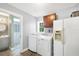 A functional laundry room equipped with modern washer and dryer units, plus a mini-split A/C at 2100 Oyster Creek Dr, Englewood, FL 34224