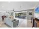 Inviting living room with large windows overlooking the serene backyard and waterfront views at 2100 Oyster Creek Dr, Englewood, FL 34224