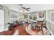 Inviting living space with a cozy dining area, musical instruments and beautiful hardwood floors at 2100 Oyster Creek Dr, Englewood, FL 34224