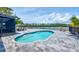Backyard pool area with comfortable seating, perfect for outdoor relaxation and entertaining at 2100 Oyster Creek Dr, Englewood, FL 34224