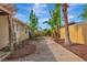 Backyard with tropical landscaping and a concrete walkway at 2620 8Th N Ave, St Petersburg, FL 33713