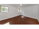 Finished basement with red tile flooring, white painted walls, and natural light at 2620 8Th N Ave, St Petersburg, FL 33713