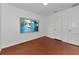 Cozy bedroom with hardwood floors, a white interior, and plenty of natural light from the window at 2620 8Th N Ave, St Petersburg, FL 33713