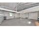 Spacious garage with two car bays, concrete floor and exposed ceiling beams at 2620 8Th N Ave, St Petersburg, FL 33713