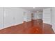 Spacious living room with gleaming hardwood floors, a bright white interior, and neutral decor at 2620 8Th N Ave, St Petersburg, FL 33713