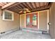 Enclosed patio with concrete flooring and red french doors leading to backyard at 2620 8Th N Ave, St Petersburg, FL 33713