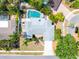Aerial view of a lovely home featuring a pool, lush landscaping, and an expansive backyard at 2726 Silver King Way, Sarasota, FL 34231
