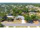 This aerial shot showcases the home's well-manicured front lawn and inviting curb appeal at 2726 Silver King Way, Sarasota, FL 34231