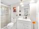 Bathroom with a glass-enclosed shower, white vanity, and modern fixtures at 2726 Silver King Way, Sarasota, FL 34231