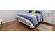 Well-lit bedroom featuring hardwood floors, a modern bed, and neutral decor at 2726 Silver King Way, Sarasota, FL 34231