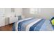 Bedroom with hardwood floors, modern decor, and a comfortable bed at 2726 Silver King Way, Sarasota, FL 34231