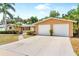 Beautiful single-story home showcases a spacious driveway and a well-maintained front yard at 2726 Silver King Way, Sarasota, FL 34231