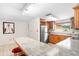 Bright kitchen with stainless steel appliances, ample counter space, and casual bar seating at 2726 Silver King Way, Sarasota, FL 34231
