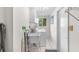 The laundry room has a utility sink, washer and dryer, and tile flooring at 2726 Silver King Way, Sarasota, FL 34231