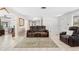 Cozy living room featuring tile floors, neutral walls, and comfortable seating at 2726 Silver King Way, Sarasota, FL 34231