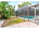 The home features a screened pool and outdoor living area at 2726 Silver King Way, Sarasota, FL 34231