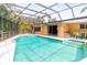 This screened pool has a spa and lots of space for seating and entertaining at 2726 Silver King Way, Sarasota, FL 34231