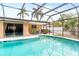 This screened pool has a spa with poolside dining at 2726 Silver King Way, Sarasota, FL 34231