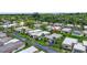 An aerial view showcases the neighborhood with mature landscaping at 2733 Riverbluff Pl # V57, Sarasota, FL 34231