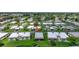Aerial view of villa community featuring lush landscaping and well-maintained exteriors at 2733 Riverbluff Pl # V57, Sarasota, FL 34231