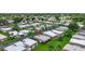 Well maintained villa community features mature palm trees and walkable streets at 2733 Riverbluff Pl # V57, Sarasota, FL 34231