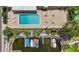 Aerial view featuring a community pool, boat docks, and recreation areas at 2733 Riverbluff Pl # V57, Sarasota, FL 34231