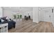Bright living room featuring wood floors and access to the screened in porch at 2733 Riverbluff Pl # V57, Sarasota, FL 34231