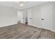 The main bedroom offers wood-look flooring and access to an ensuite bathroom with modern fixtures at 2733 Riverbluff Pl # V57, Sarasota, FL 34231