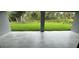 Tiled patio overlooking a lush, green backyard surrounded by trees at 2881 Pope St, North Port, FL 34287