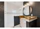 This updated bathroom features granite counters, sleek fixtures, and a glass shower door, creating a spa-like atmosphere at 307B 63Rd St, Holmes Beach, FL 34217