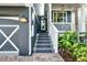 Inviting entryway with well-lit steps, leading to the front door and showcasing the home's exterior at 307B 63Rd St, Holmes Beach, FL 34217