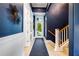 Stylish entryway with elegant decor, sleek staircase, and a welcoming atmosphere at 307B 63Rd St, Holmes Beach, FL 34217