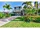 Captivating home featuring a quaint balcony, delightful landscaping, and a charming curb appeal at 307B 63Rd St, Holmes Beach, FL 34217