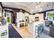 The kitchen features granite counters, stainless steel appliances, and white cabinetry, creating a bright and functional space at 307B 63Rd St, Holmes Beach, FL 34217
