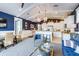 Airy living room with beachy decor flows into the open kitchen and dining area at 307B 63Rd St, Holmes Beach, FL 34217