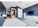 Well-decorated main bedroom with an en-suite bathroom and a view of a TV and furniture at 307B 63Rd St, Holmes Beach, FL 34217