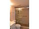 Bathroom features a tiled shower with a glass door, plus modern fixtures and a clean design at 3269 Beneva Rd # 203, Sarasota, FL 34232
