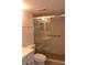 Bathroom features a tiled shower with a glass door, plus modern fixtures and a clean design at 3269 Beneva Rd # 203, Sarasota, FL 34232