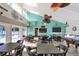 Spacious community room with comfortable seating, billiards, and large windows overlooking the pool at 3269 Beneva Rd # 203, Sarasota, FL 34232