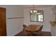 Dining area with a wooden table and view reflected in a mirror at 3269 Beneva Rd # 203, Sarasota, FL 34232