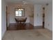 Cozy dining area with wood floors and a view into the kitchen at 3269 Beneva Rd # 203, Sarasota, FL 34232