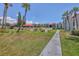 Expansive lawns, mature palms, walkways, and garden-style condominiums at 3269 Beneva Rd # 203, Sarasota, FL 34232