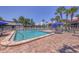 Another swimming pool view with lounge chairs and tables with umbrellas at 3269 Beneva Rd # 203, Sarasota, FL 34232