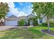 Charming single-story home with a well-manicured lawn, lush landscaping, and inviting entrance, enhancing its curb appeal at 3309 45Th E Ave, Bradenton, FL 34203