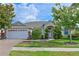 Charming home with manicured lawn, lush landscaping, and attached two-car garage in a serene neighborhood at 3309 45Th E Ave, Bradenton, FL 34203